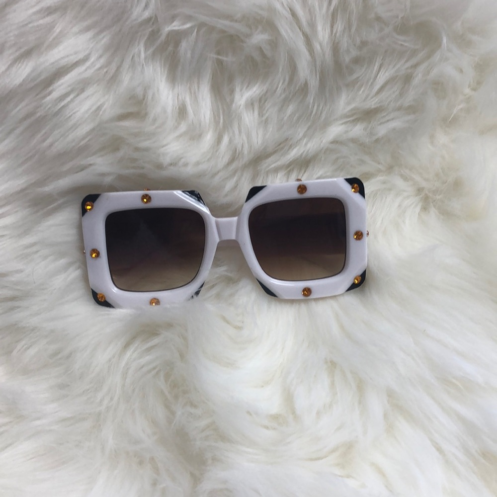 White sunglasses with brown gradient lenses.